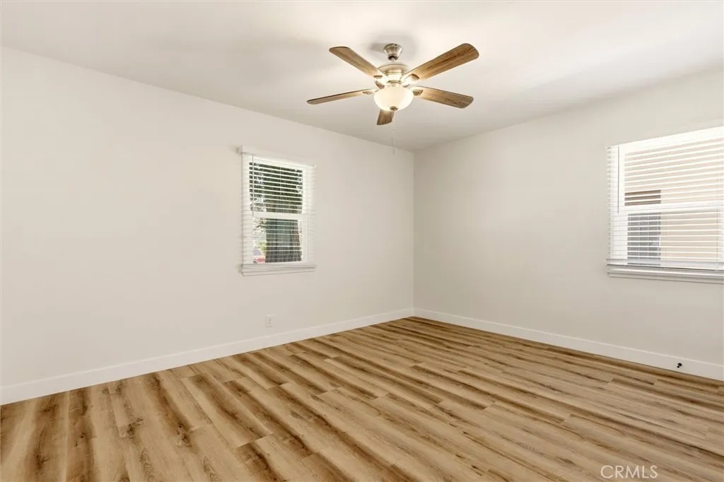 Bright and versatile, the secondary bedroom is ideal for guests, a nursery, or a home office.