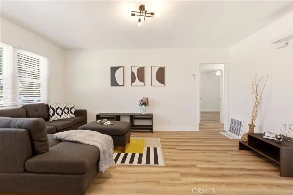 Walk in to tons of natural light peeking through brand new windows in this beautifully remodeled home.