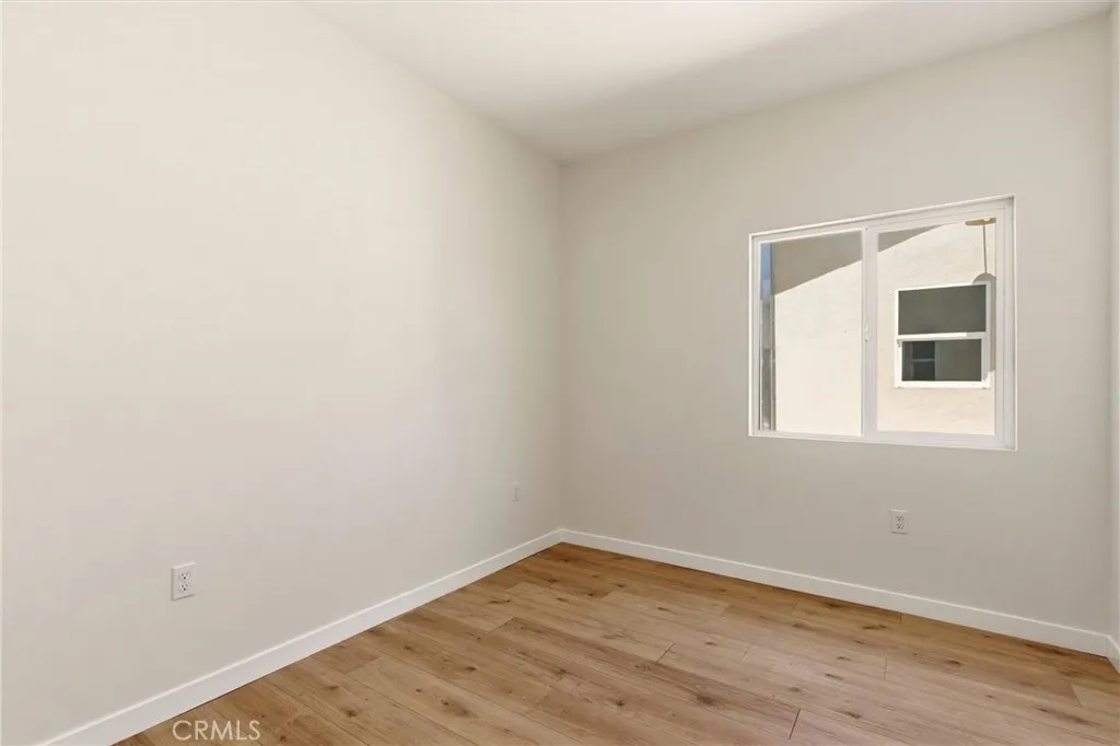 Unit B - Primary bedroom with ensuite bathroom.