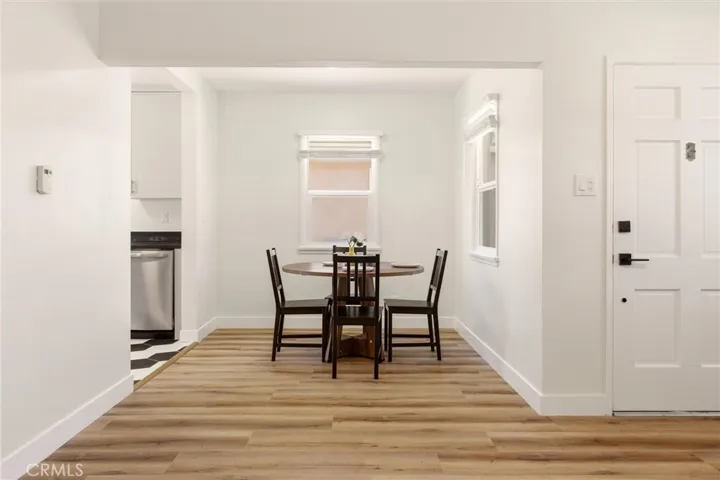 The open dining area flows seamlessly between the living room and kitchen, creating the perfect space for everyday meals or hosting family and friends.