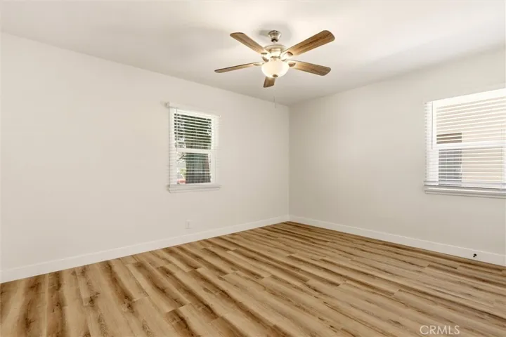 Bright and versatile, the secondary bedroom is ideal for guests, a nursery, or a home office.