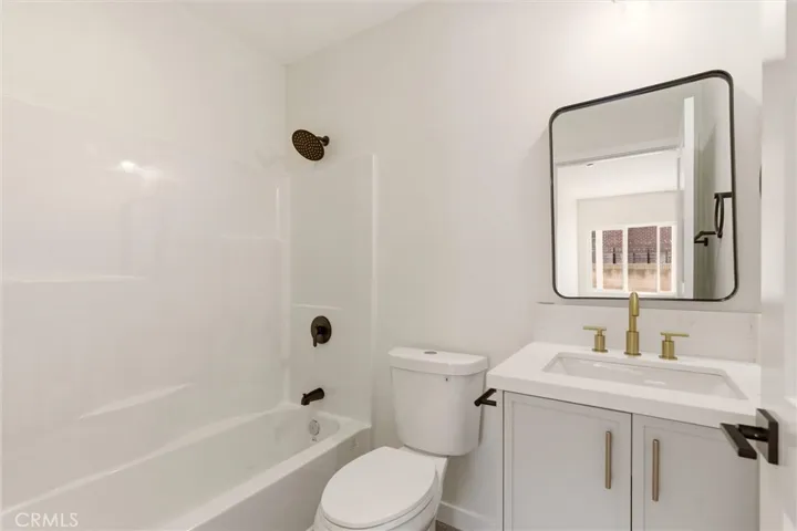 Unit A - The private en-suite bathroom features modern finishes and a clean contemporary design for a spa-inspired feel.