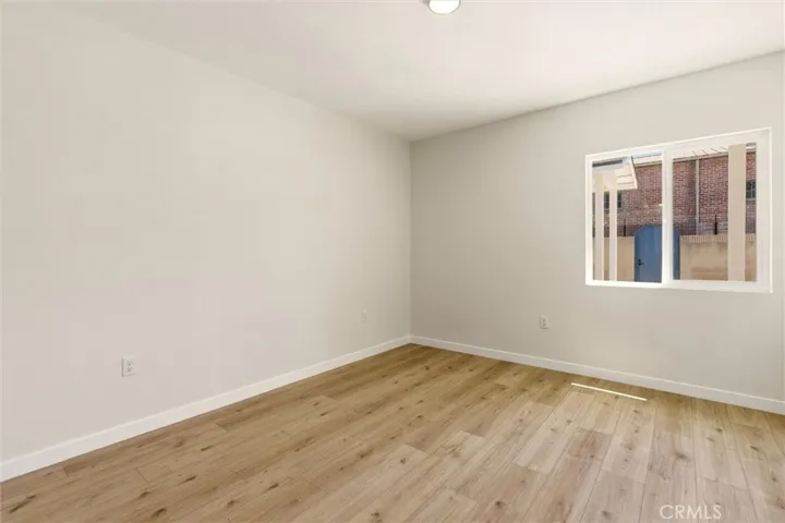 Unit A - The spacious bedroom offers comfort and privacy with direct access to the en-suite bathroom.