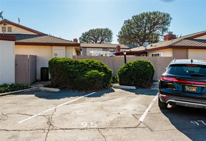 Single car parking spot assigned to home.