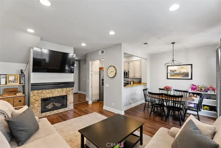 Living Room Opens to Kitchen and Dining Area