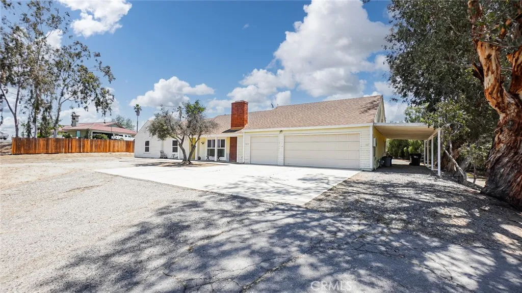 A spacious 3-CAR GARAGE with ample parking. potential for ADU/JADU use, workshop space, storage, or hobby needs