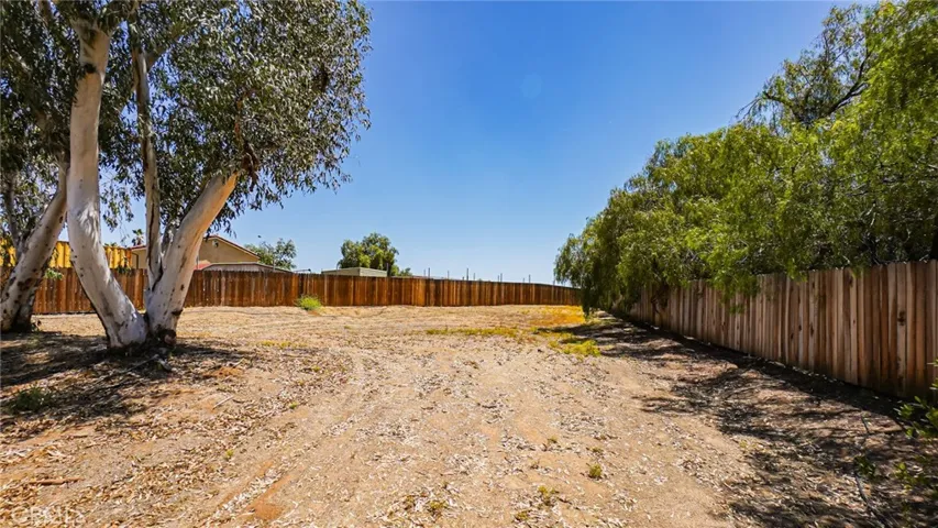 This property offers character, generous interior space, and a large usable yard.