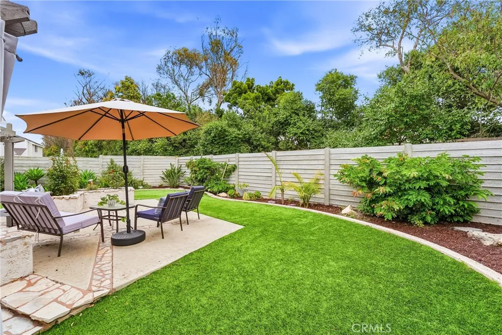 Enjoy one of the largest yards in the Season's tract. This one being "pie" shaped wraps around the home