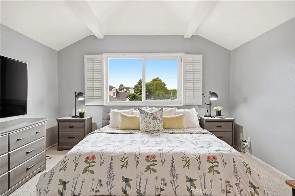 Spacious primary bedroom with full walk in closet.