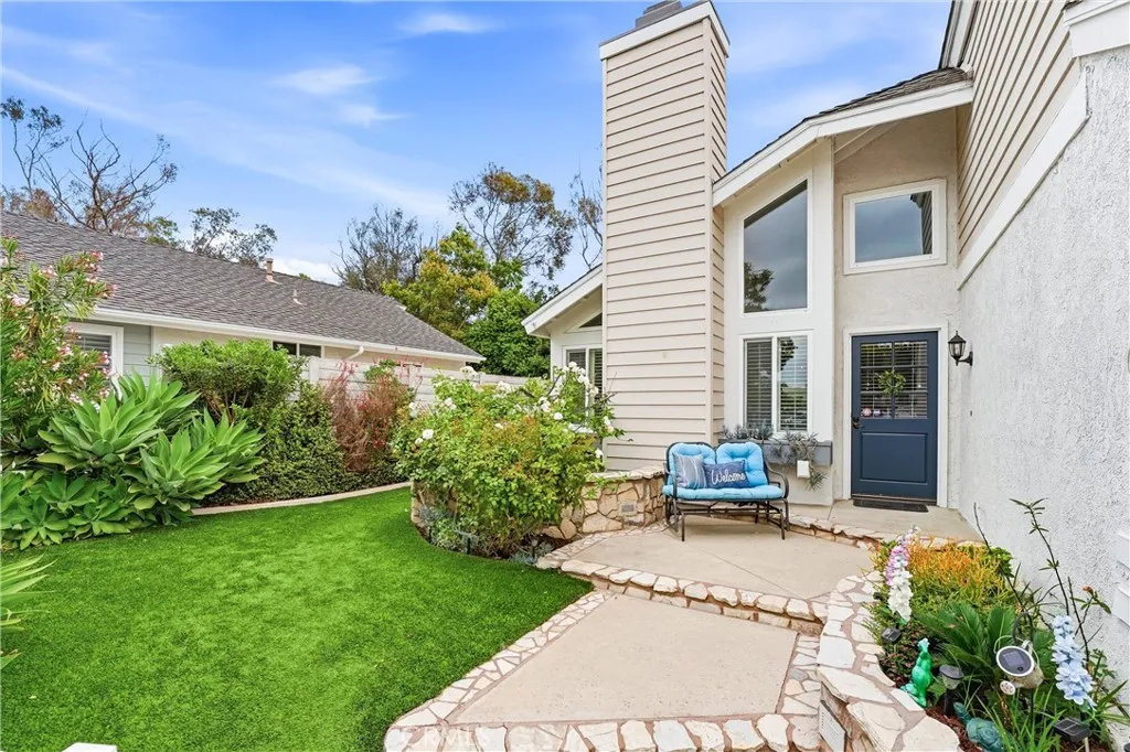 Private fenced in front yard is an added bonus to this beautiful home.