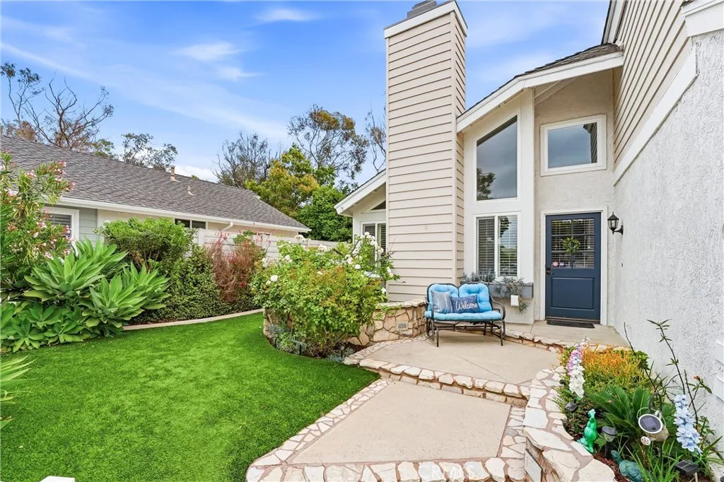 Private fenced in front yard is an added bonus to this beautiful home.