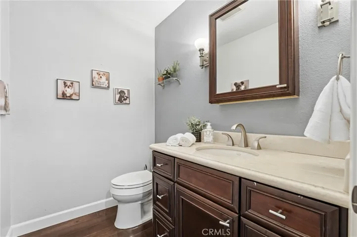 Handsome half bath with sconce lighting