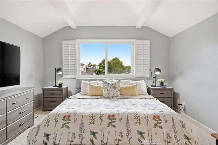 Spacious primary bedroom with full walk in closet.