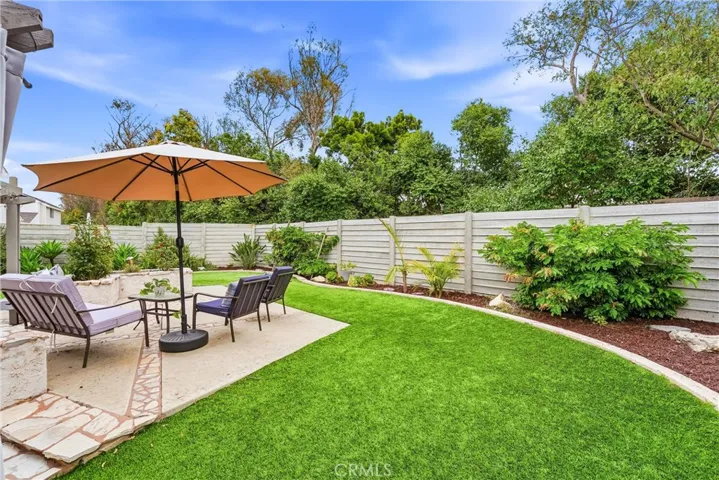 Enjoy one of the largest yards in the Season's tract. This one being "pie" shaped wraps around the home