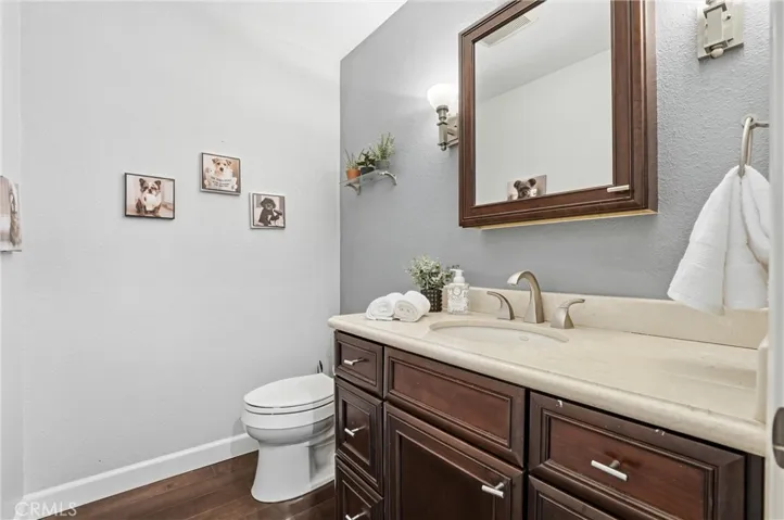 Handsome half bath with sconce lighting
