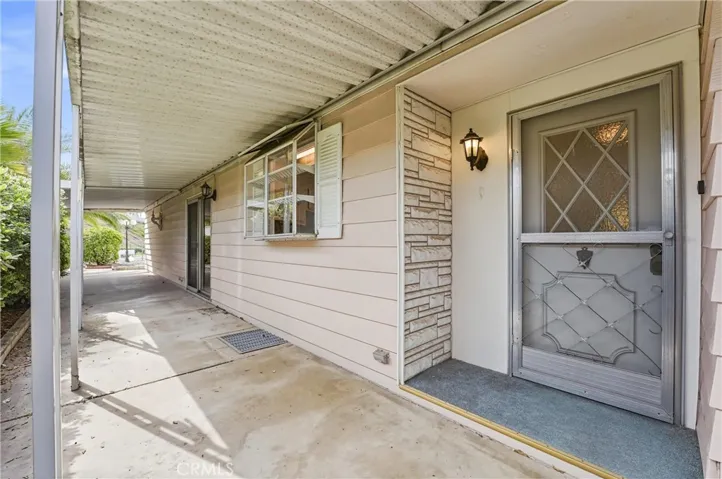 Front entryway with an attached covered patio that sits off the family room and kitchen!