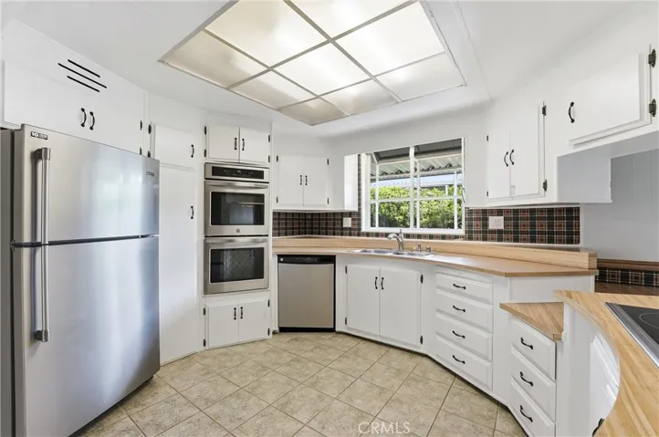 Large window above the kitchen sink with tons of storage and countertop space!