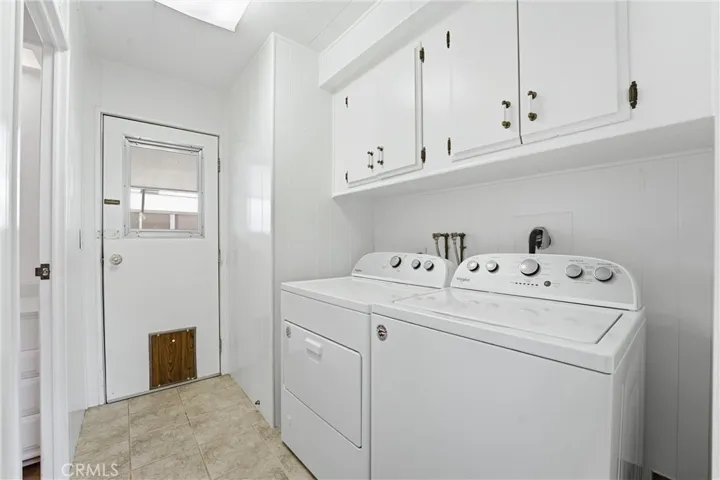 Laundry Room with tons of storage and access to the carport!
