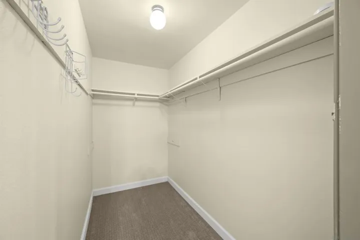 Primary bedroom walk-in closet.