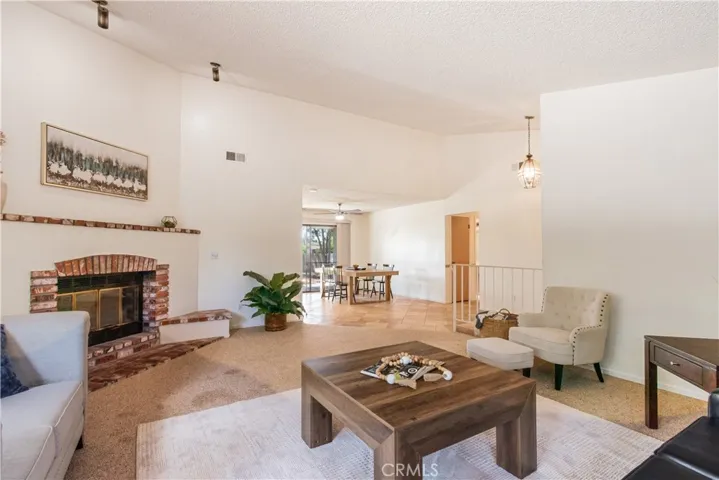 Living room with wood burning fireplace