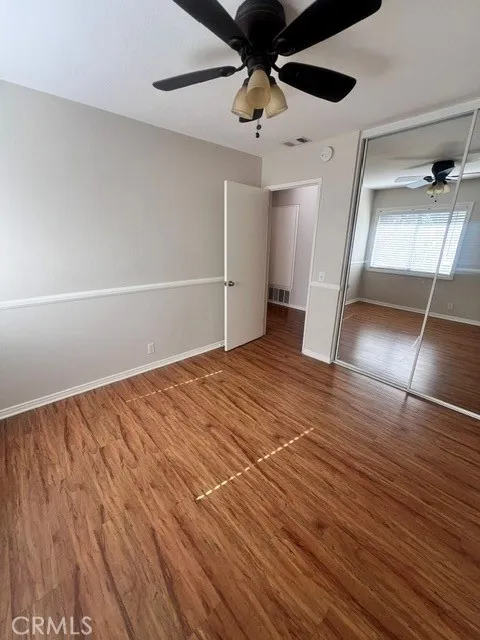 Bedroom 2-mirrored closet ceiling fan