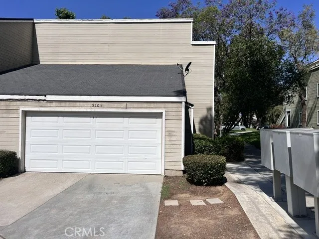2 car garage with shelf and pull down storage