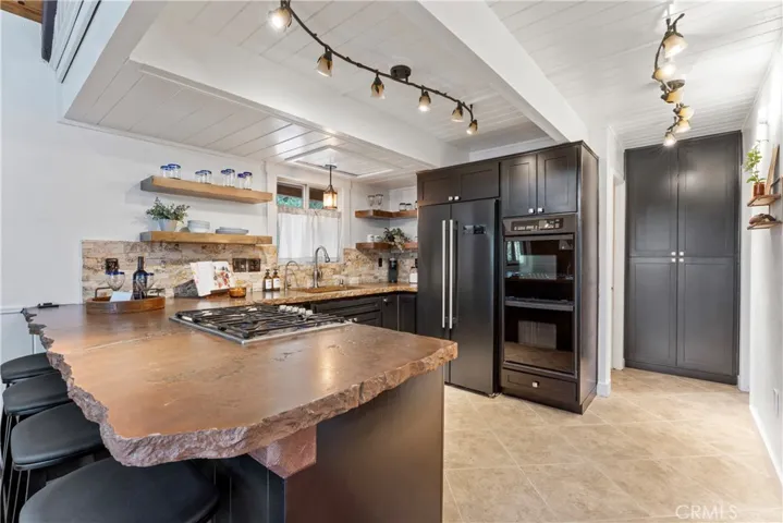 LOOK AT ALL THE COUNTER SPACE and custom cabinets!