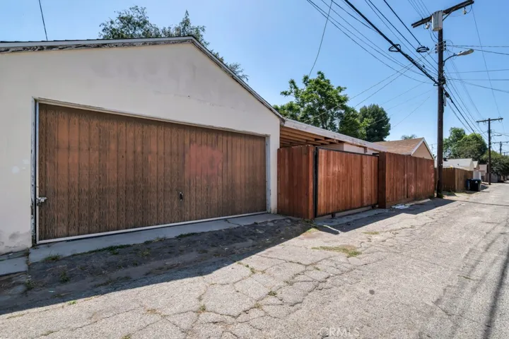 Garage with alley access and gated back yard.