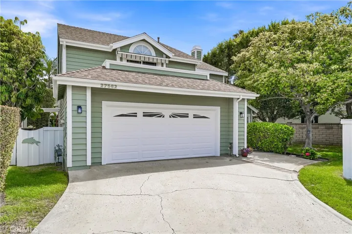 Attractive front elevation showcases classic architectural details, manicured grounds, and a welcoming approach to the home.
