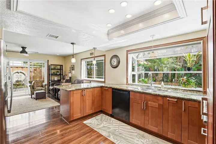 Bright and open, the kitchen flows effortlessly into the adjacent living spaces, making it ideal for both everyday living and entertaining.