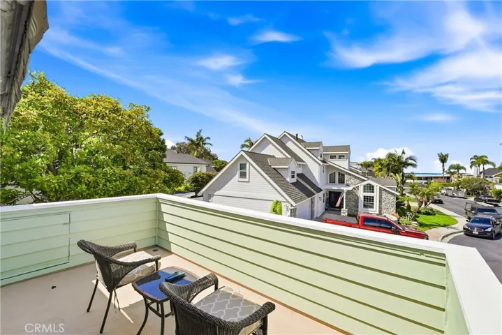 Private balcony provides a quiet outdoor escape with room for seating and neighborhood views. Enjoy fresh air, morning sunshine, or evening breezes from your own retreat.