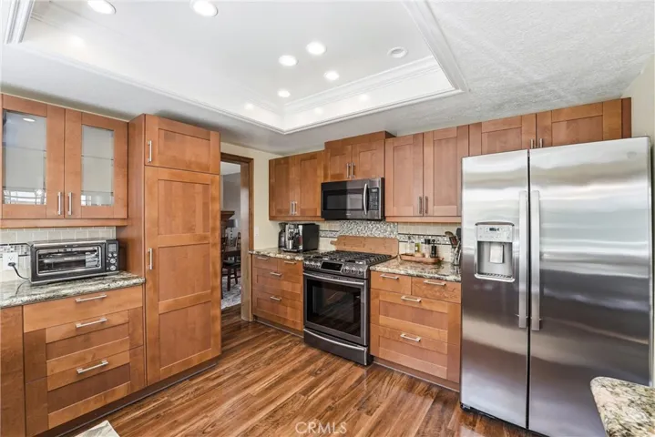 Another view of the kitchen highlights the extensive cabinetry, quality finishes, and spacious layout designed to accommodate busy households.