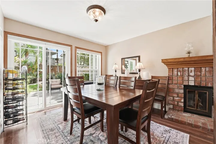 The dining area provides an ideal setting for everyday meals or special occasions, with direct access to the backyard for seamless indoor-outdoor entertaining.