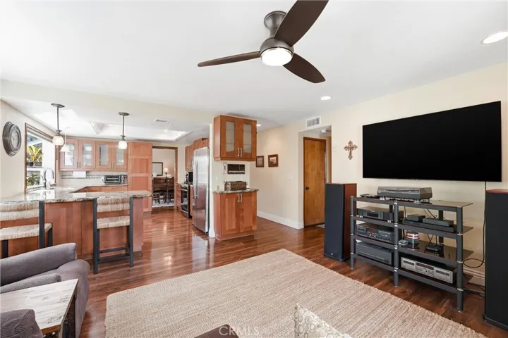 Open sightlines between the family room and kitchen create a connected living environment that enhances everyday functionality and entertaining.