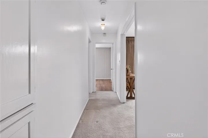 Hallway, in between top & bottom cabinet is a pullout to help fold laundry