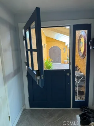 Front door behind private courtyard