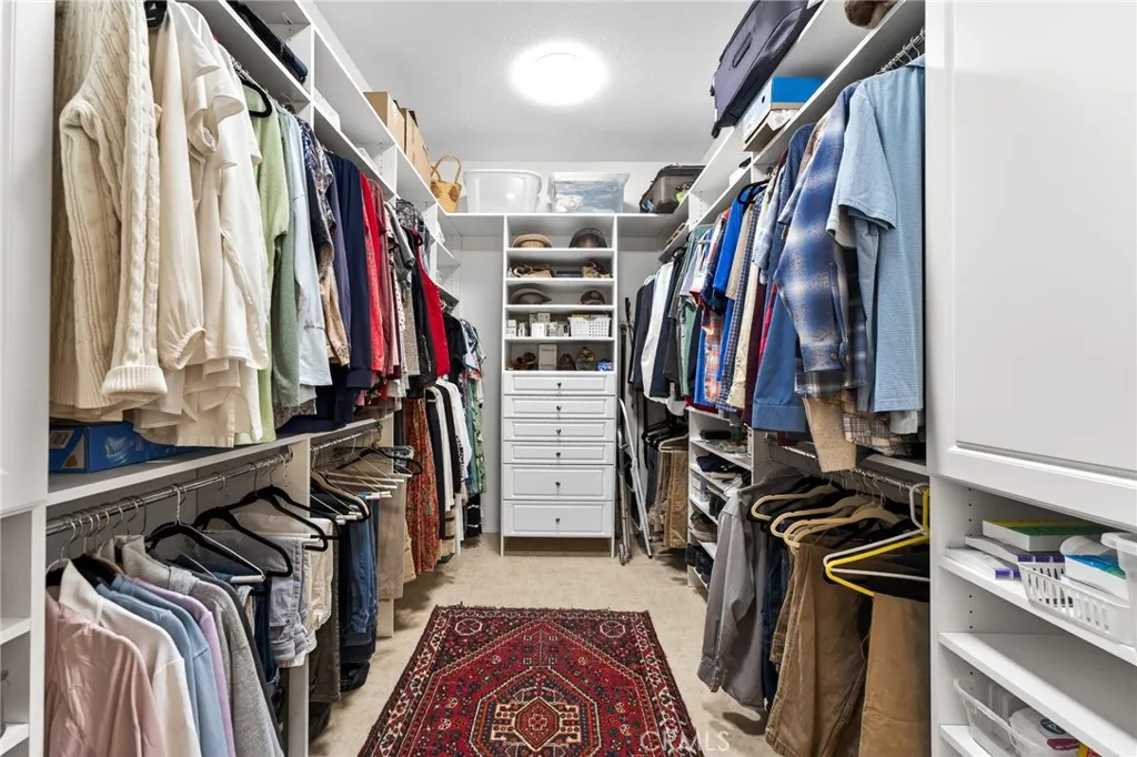 Organized Primary Walk-in Closet