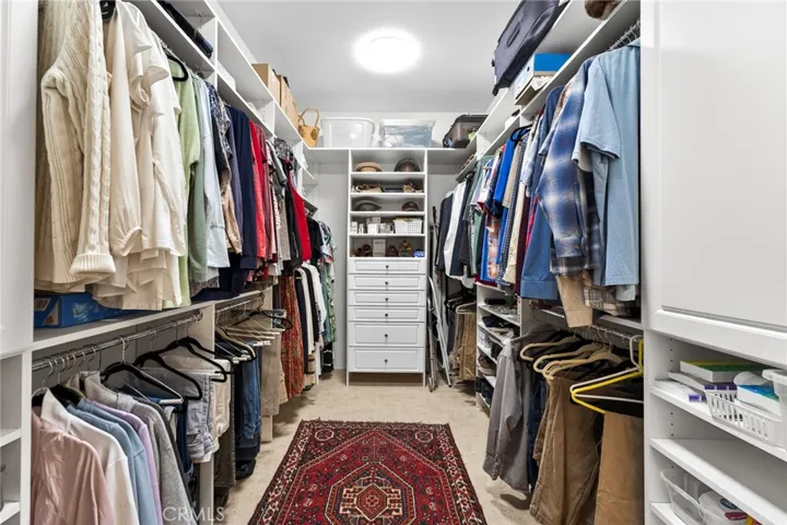 Organized Primary Walk-in Closet