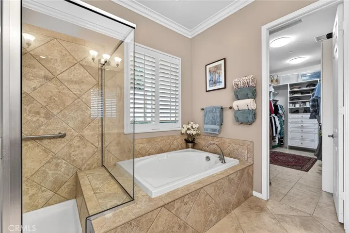 Primary Bathroom has Separate Oval Tub and Bench Seat in Shower