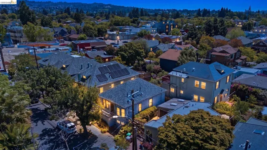 Residential property featuring multiple structures with varying rooflines