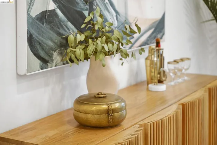 Light wood-finish console table featuring slatted detailing and a smooth top surface