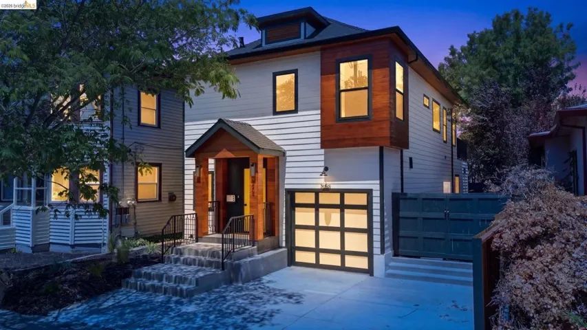 Contemporary exterior featuring horizontal siding and wood panel accents
