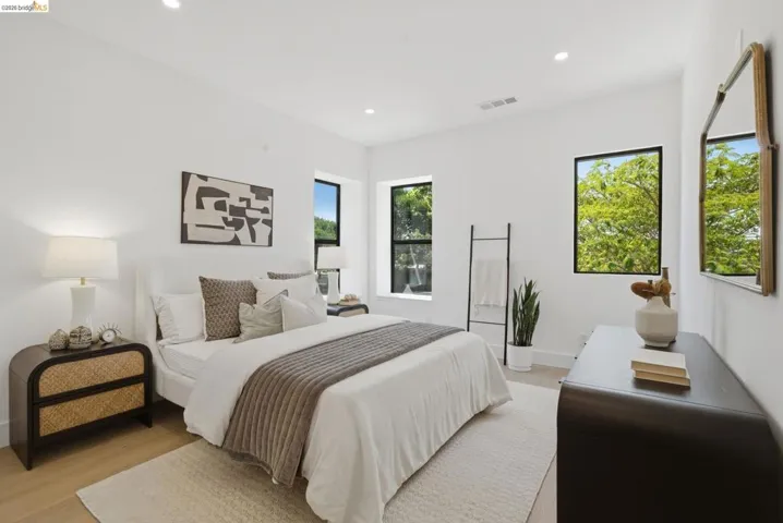 Bright room featuring two large windows with black frames