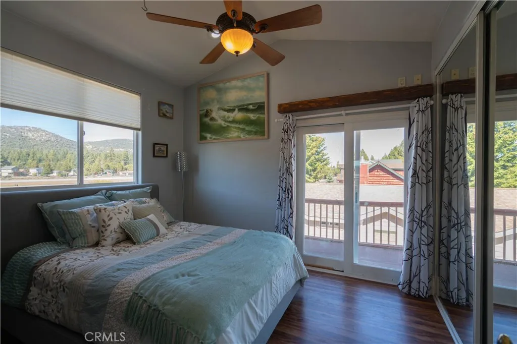 Spacious bedroom featuring an abundance of natural light, generous storage capacity, and direct access to a private balcony.