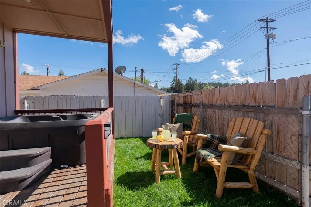 *AI FURNISHED* This photo has been virtually staged to show the potential of the space if utilized as a front yard common space.