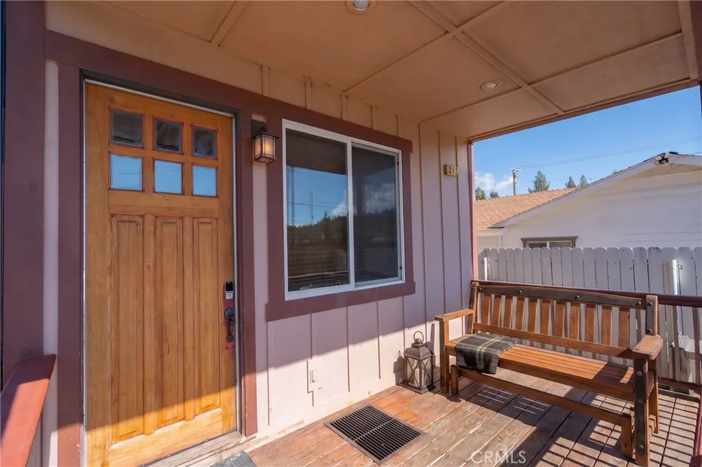 The front porch offers generous space, making it perfect for setting up comfortable lounge furniture.