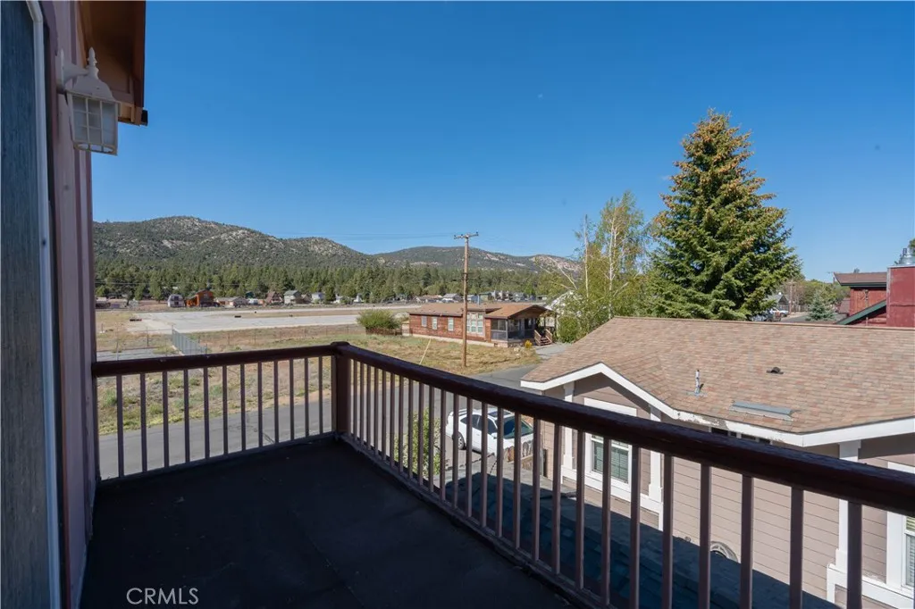 Spacious second-bedroom balcony featuring ample room for outdoor furniture, perfect for relaxing and stargazing.