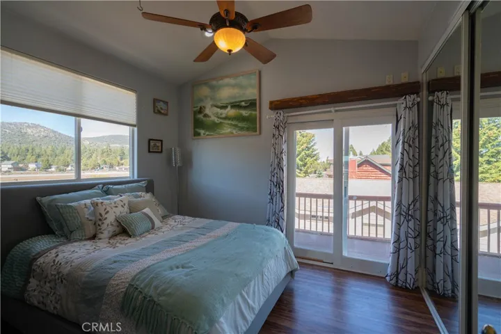 Spacious bedroom featuring an abundance of natural light, generous storage capacity, and direct access to a private balcony.