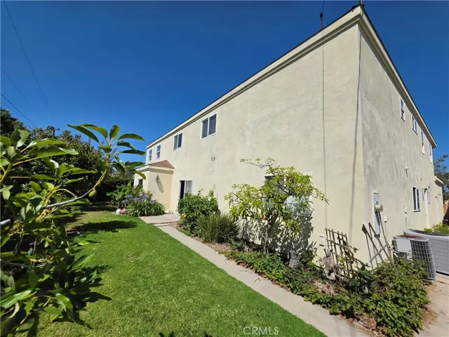 Paved walkway around the south side of the house