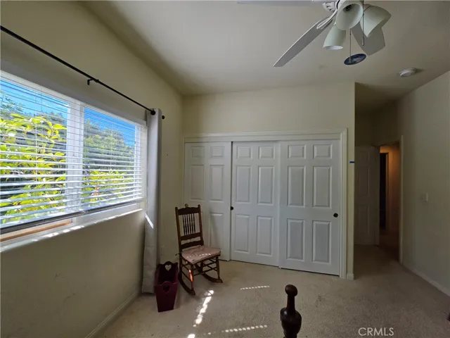 Primary Bedroom with 9" ceilings and wall-to-wall closet